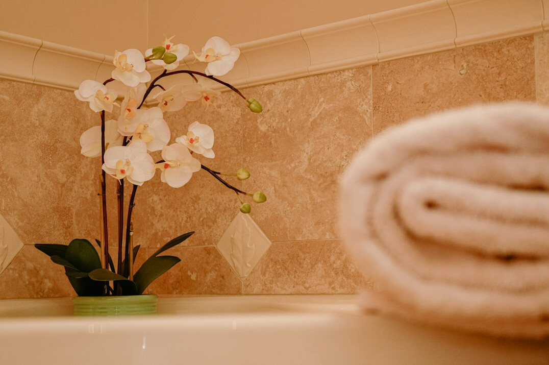 Spa towels and orchids prepared for a full body treatment