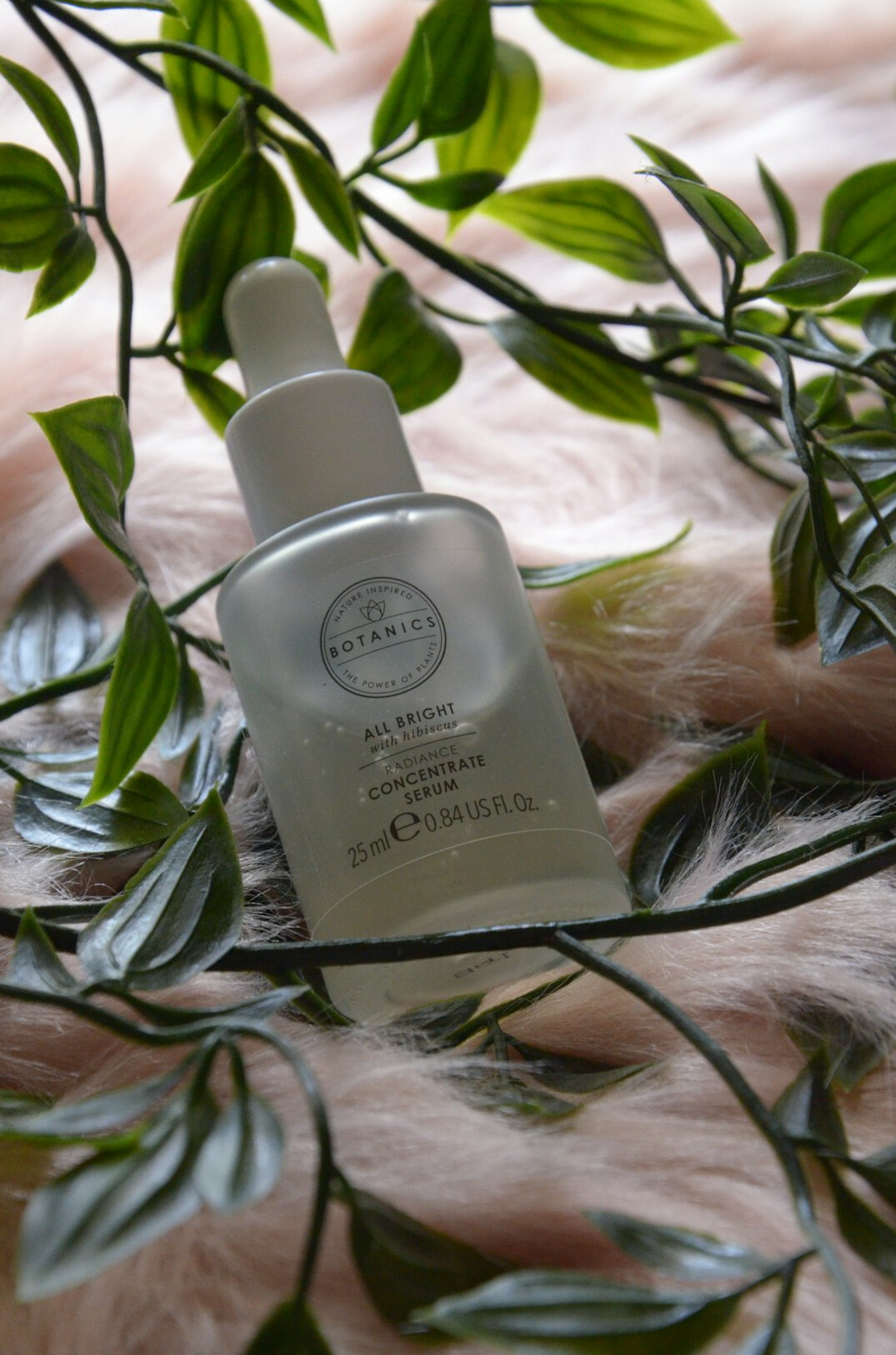 Moisturizing serum bottle on a light background