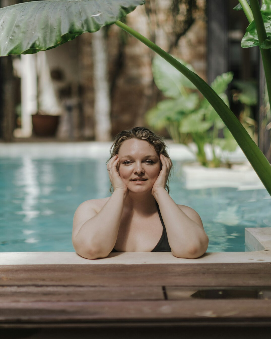 Woman relaxing with a calm expression during a spa skincare treatment