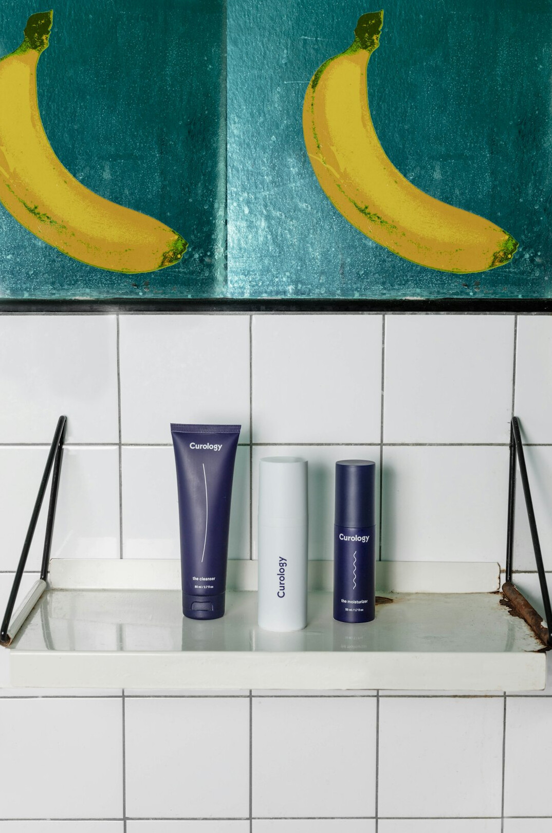 Skincare bottles lined up on a clean shelf